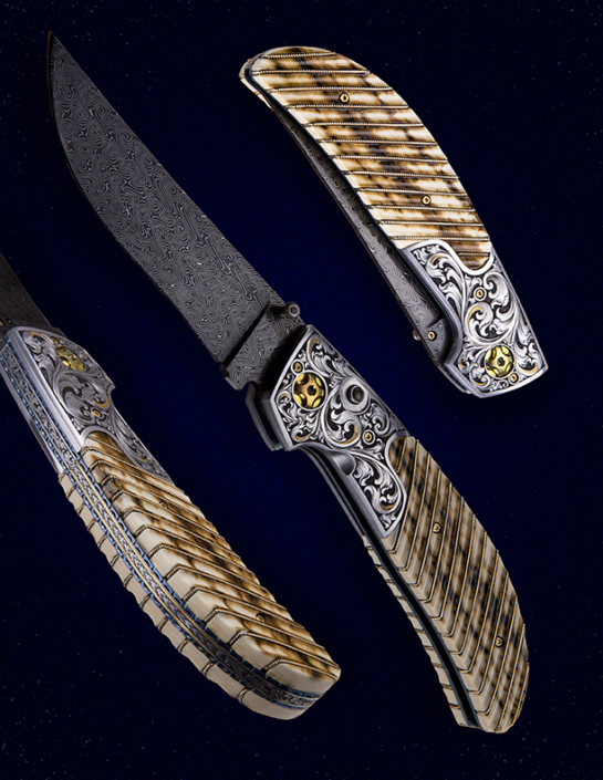 The "Vaquero" Double Action Auto, fitted with a 3 3/4" blade of Doug Ponzio's Turkish Twist Damascus, fluted Mammoth ivory scales with 14k gold wire inlays, and hand engraved bolsters and backspacer by Master Engraver, Wes Griffin. Available for immediate delivery $6950.00. Click on image for hi res picture.